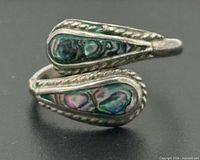 Front view of sterling silver bypass ring with abalone inlay