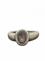 Front view of ring showing oval amethyst bezel and band