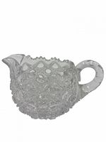 side view showing overall shape, pattern, handle and spout