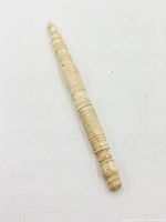 Overall view of carved needle case sewing stiletto