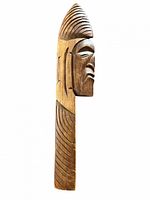 Front view of carved wood plaque showing Indigenous face design and overall condition