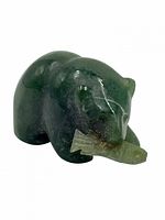 Front view showing bear holding fish