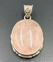 Front view of oval rose quartz sterling silver pendant