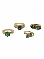 Group shot of four gold plated gemstone rings