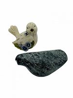 Front view of both bird figurines