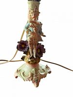 Close-up of gentleman figurine lamp base showing porcelain details