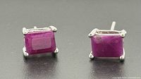 Front view of both ruby stud earrings showing stones and prong settings
