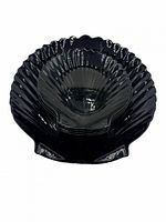 Stacked large and small black glass shell plates showing overall set