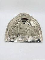 Front view showing full tray and embossed scene
