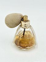 Full view of perfume bottle showing glass body, cap and bulb