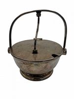 Closed ice bucket showing handle, lid and overall form