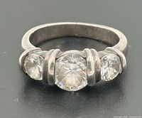 Front view of sterling silver ring showing three CZ stones