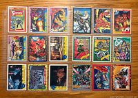 Fronts of all 18 trading cards in sleeve