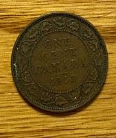 Reverse of 1912 Canadian large cent showing ONE CENT CANADA 1912 and maple leaf wreath