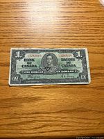 Obverse of 1937 $1 bill showing portrait, serial number, signatures