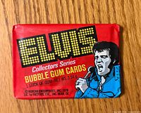 Front of sealed red wax pack showing Elvis illustration and title text