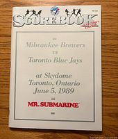 Front cover of June 5 1989 scorebook showing teams, venue, sponsor, price