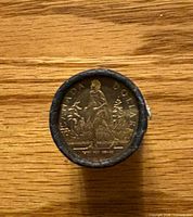 End of sealed roll showing Terry Fox $1 coin design