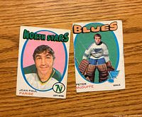 Fronts of both 1971-72 O-Pee-Chee hockey cards showing player images and team names