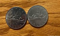 Reverse of two 1972 Canada Voyageur dollars