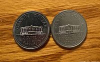 Front and reverse of two 1973 Canada PEI $1 coins