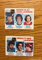 Fronts of both leader cards showing players and titles