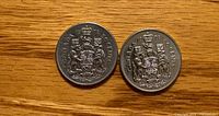 Both 1978 Canada 50-cent coins showing reverse with Coat of Arms