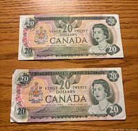 Obverse of both 1979 Canadian $20 bills showing Queen Elizabeth II, denominations, colours