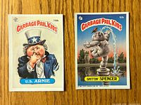 Fronts of both Garbage Pail Kids sticker cards showing U.S. Arnie #110b and Spittin' Spencer #92b