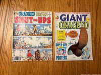 Front covers of both Cracked magazines