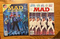 Front covers of both MAD magazines