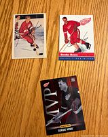 Front view of three Gordie Howe trading cards