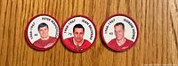 Obverse showing portraits and names of the three hockey coins