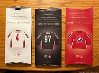 Front of three McDonald’s 2006 Team Canada mini jersey boxes for Lecavalier, Thornton, Brodeur