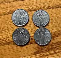 Four 1945 Victory nickels reverse side showing "V" torch design