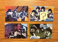 Fronts of four Beatles postcards displaying different psychedelic collage designs