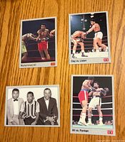 Fronts of four Muhammad Ali boxing trading cards