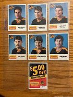 Front view of six player cards and coupon in sleeve