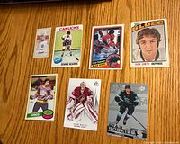 Front view of all seven hockey cards laid out on table