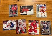 Front view of seven Johnny Gaudreau hockey cards laid out