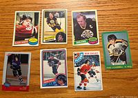 Front view of all seven hockey cards showing player images and teams