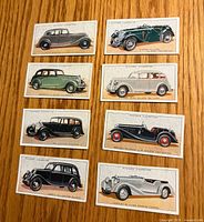Fronts of eight 1936 John Player Motor Car cigarette cards showing colour automobile illustrations