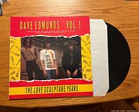 Front cover showing album title, artist, and vinyl partially out of sleeve