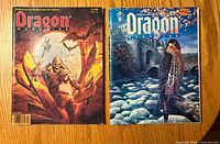 Front covers of both magazines showing artwork and issue numbers