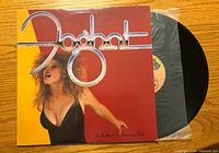 Front jacket art and partially exposed vinyl