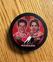 Front view showing player portraits, signatures and Canada logo