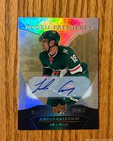 Front of autographed Jordan Greenway Upper Deck Trilogy Rookie Premieres Level 2 card showing autograph and serial number