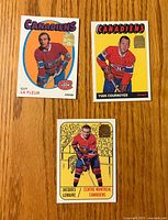 Fronts of three Montreal Canadiens player cards with gold foil stamps