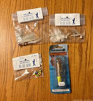 All four sealed items on tabletop