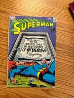 Front cover of Superman #213 comic showing title, issue number, cover art